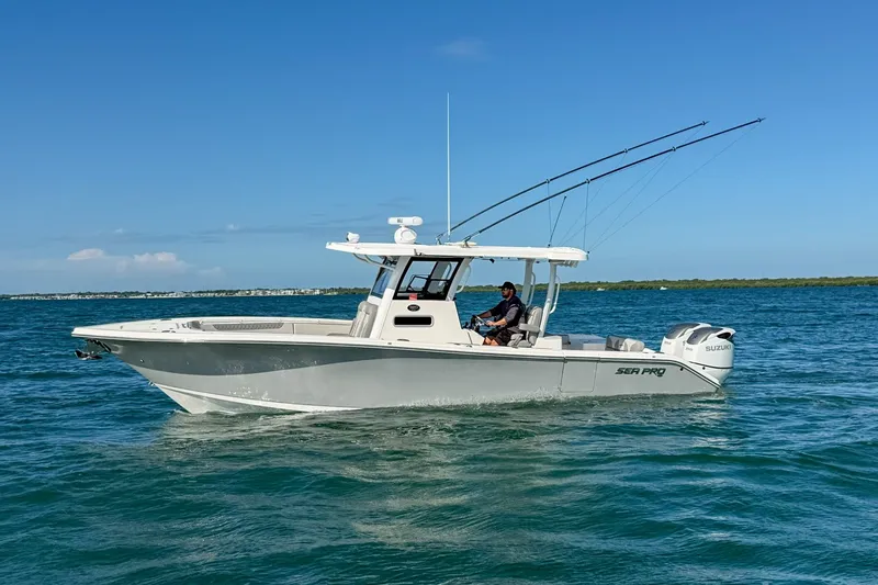 Slide: The Image of 2023 Sea Pro 320 DLX Offshore boat cruising on open water. - 1