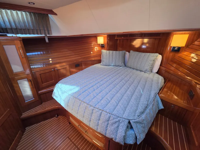 Slide: The Image of Luxurious cabin with wooden walls, a cozy double bed, and soft lighting. - 24