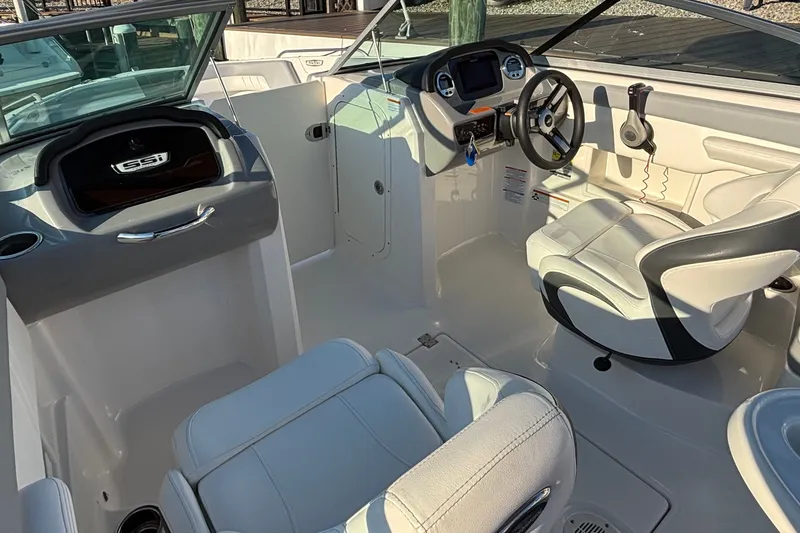 Slide: The Image of Interior of 2022 Chaparral 23 SSi OB boat with modern dashboard and seating. - 13