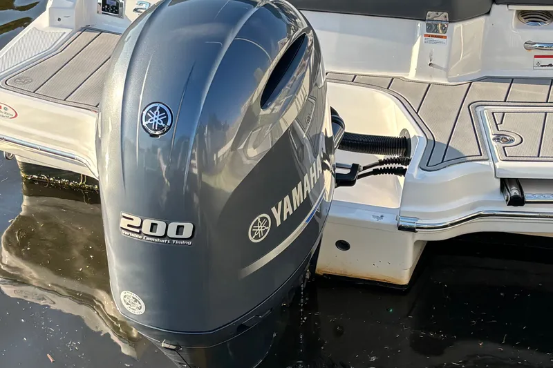 Slide: The Image of 2022 Chaparral 23 SSi OB boat with Yamaha 200 outboard motor on water. - 22