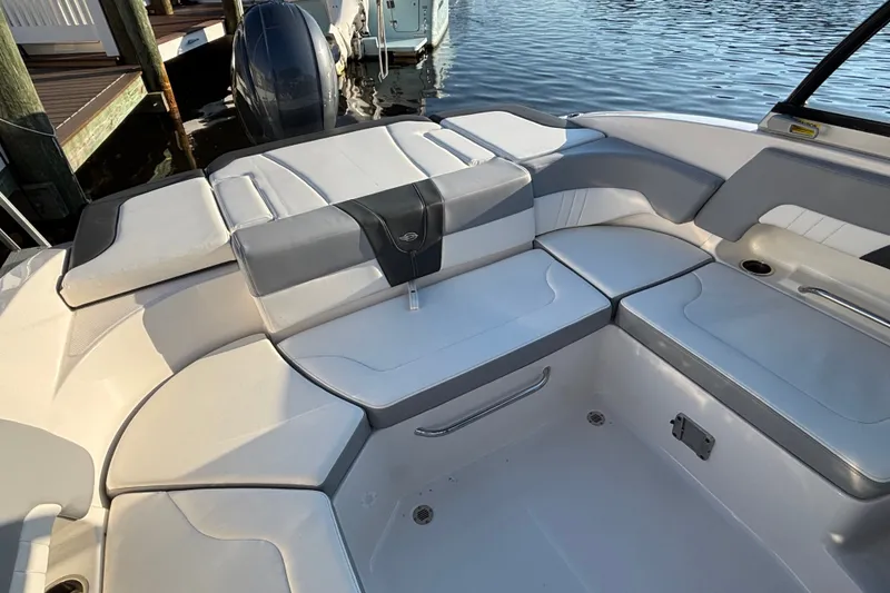 Slide: The Image of 2022 Chaparral 23 SSi OB boat interior with cushioned seating and sleek design. - 19