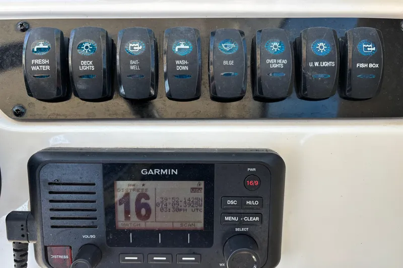 Slide: The Image of Control panel of a 2018 Sailfish 245 DC boat with Garmin device. - 13