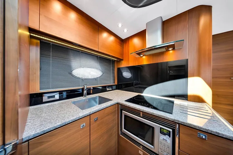 Slide: The Image of Luxurious kitchen interior of 2015 Princess V48 yacht with modern appliances and sleek design. - 33