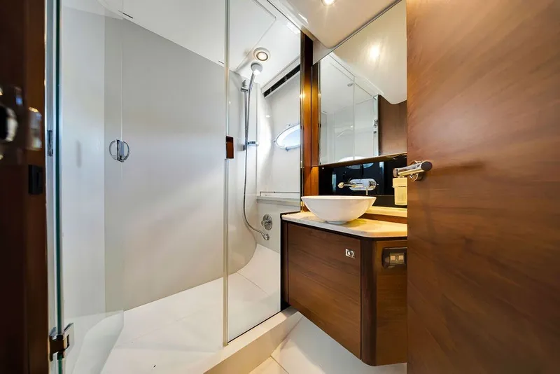 Slide: The Image of Luxurious bathroom interior of 2015 Princess V48 yacht with modern fixtures and wooden accents. - 45