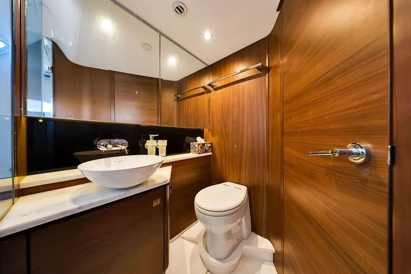 Slide: The Image of Luxurious bathroom in 2015 Princess V48 yacht with wood paneling and modern fixtures. - 47