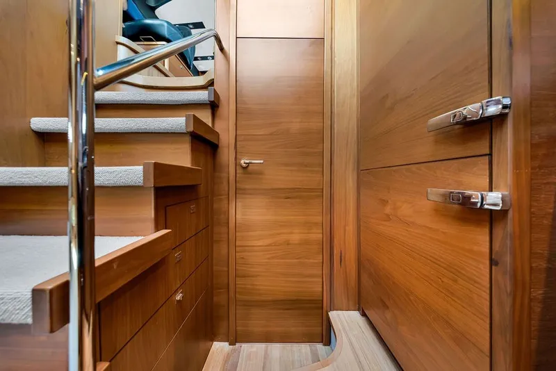 Slide: The Image of Interior of 2015 Princess V48 yacht with wooden stairs and cabinetry. - 38
