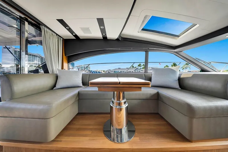Slide: The Image of Luxurious interior of 2015 Princess V48 yacht with elegant seating and panoramic windows. - 22