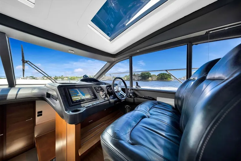 Slide: The Image of Luxurious 2015 Princess V48 yacht interior with leather seating and advanced navigation system. - 27