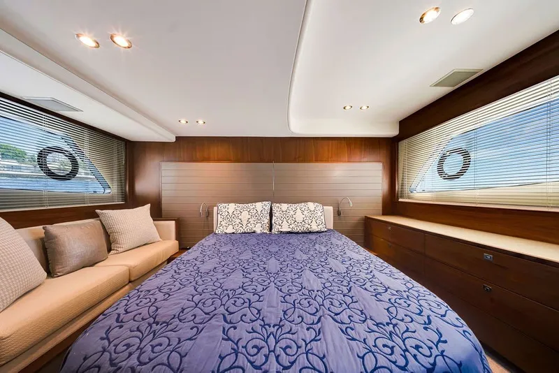 Slide: The Image of Luxurious bedroom interior of 2015 Princess V48 yacht with elegant bedding and wood accents. - 40