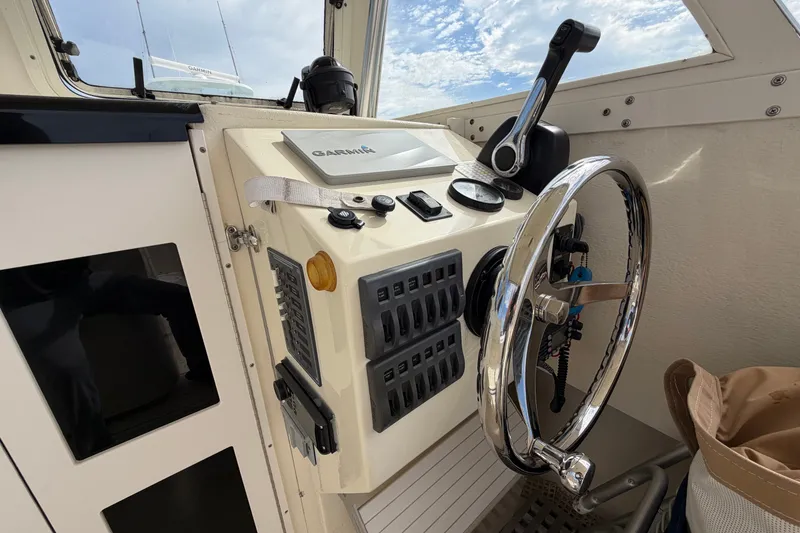 Slide: The Image of 2017 Seaway Offshore boat helm with Garmin navigation and control panel. - 13