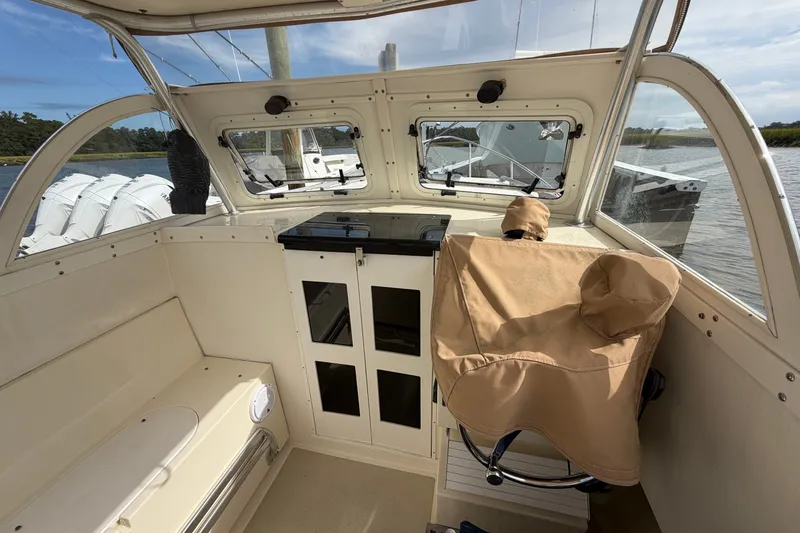 Slide: The Image of 2017 Seaway Offshore boat interior with covered seat and storage cabinets. - 12