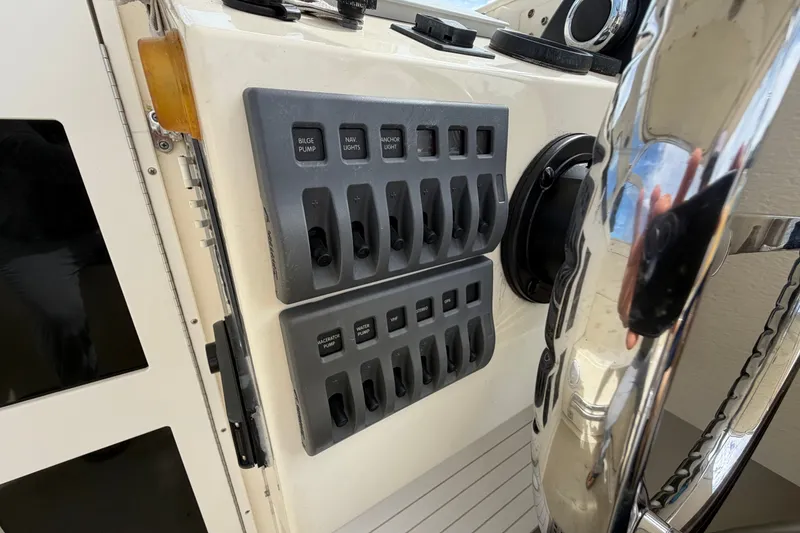 Slide: The Image of Control panel on a 2017 Eastern Boats Seaway Offshore, featuring various switches and labels. - 14