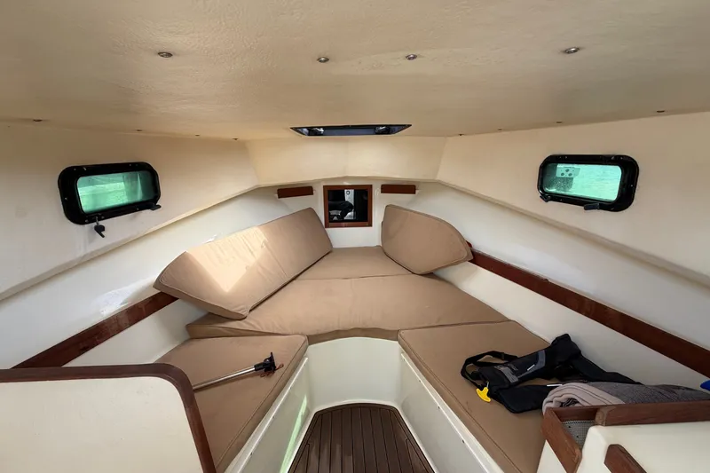 Slide: The Image of 2017 Seaway Offshore cabin interior with beige cushions and wooden accents. - 18