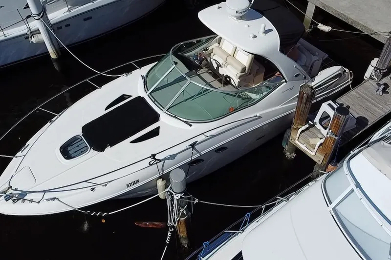 Slide: The Image of 2012 Sea Ray 330 Sundancer yacht docked at marina, aerial view. - 4