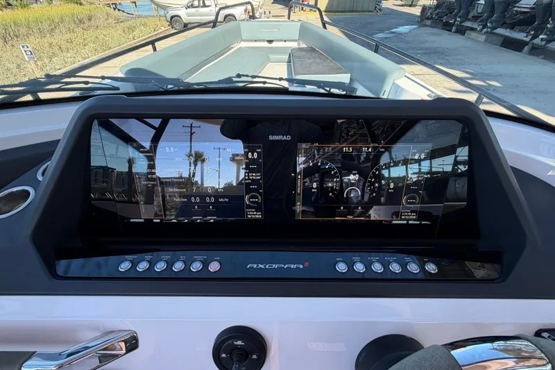 Slide: The Image of Dashboard of 2023 Axopar 28 T-Top boat with digital displays and controls. - 22