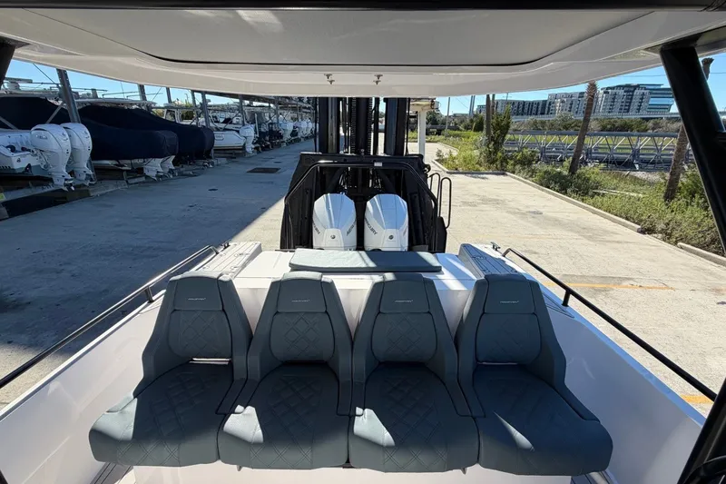 Slide: The Image of 2023 Axopar 28 T-Top boat with stylish seating and modern design. - 24