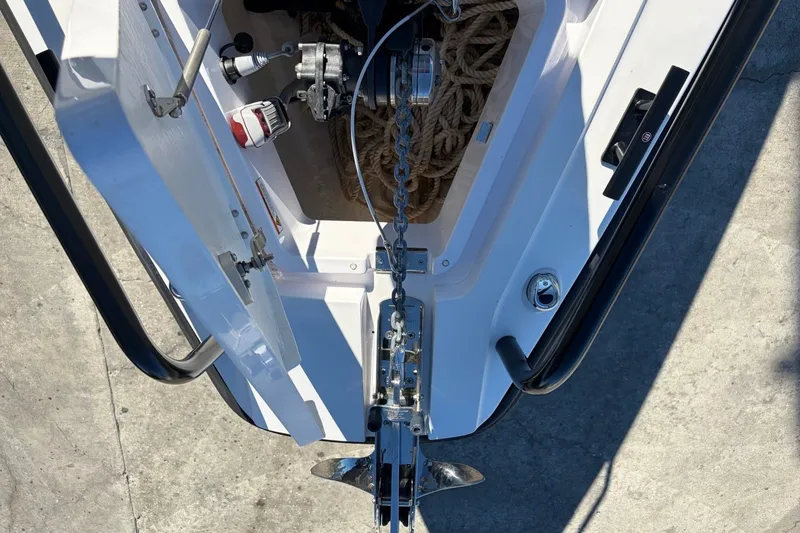 Slide: The Image of 2023 Axopar 28 T-Top boat anchor system with ropes and winch. - 10