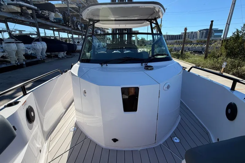 Slide: The Image of 2023 Axopar 28 T-Top boat with sleek design and spacious deck. - 13