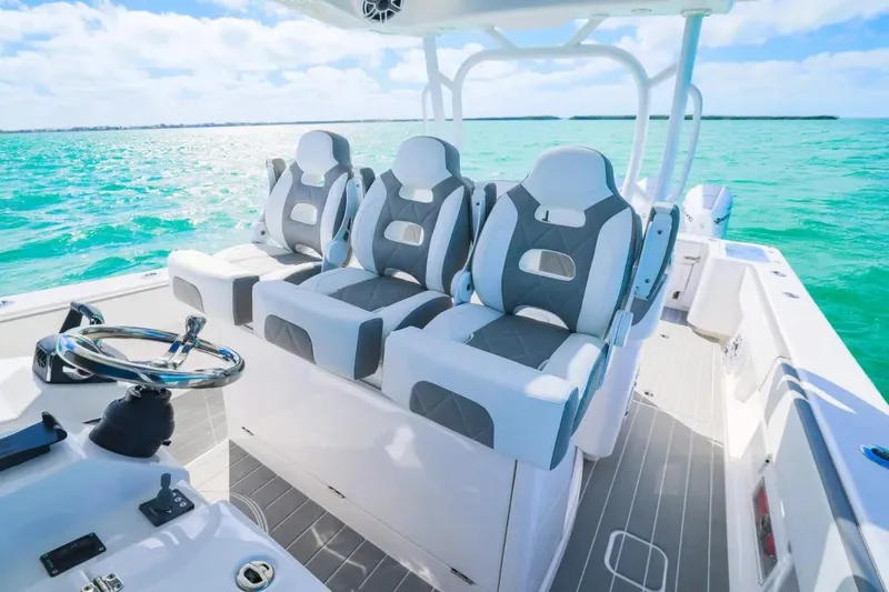 Slide: The Image of Manufacturer Provided Image: 2025 Blackwater 43 Luxury Fish boat interior with plush seating on turquoise water. - 4