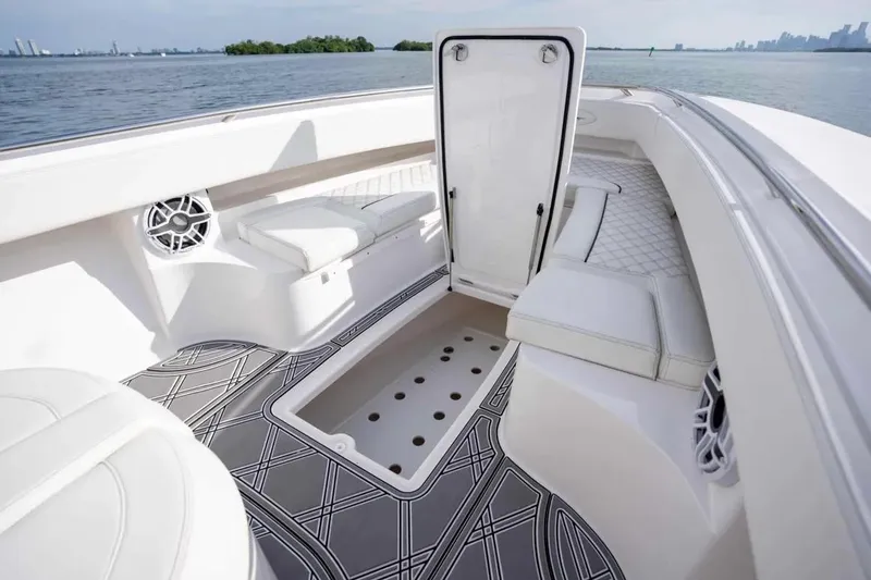 Slide: The Image of Manufacturer Provided Image: Luxurious interior of 2025 Blackwater 43 Luxury Fish boat with elegant seating and storage. - 2