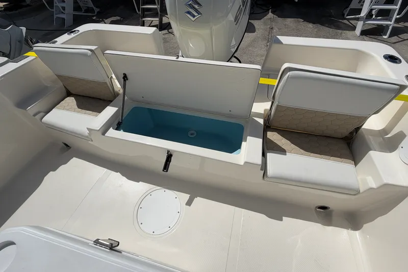 Slide: The Image of 2027 Bulls Bay 2200 XS boat interior with seating and storage compartments. - 16