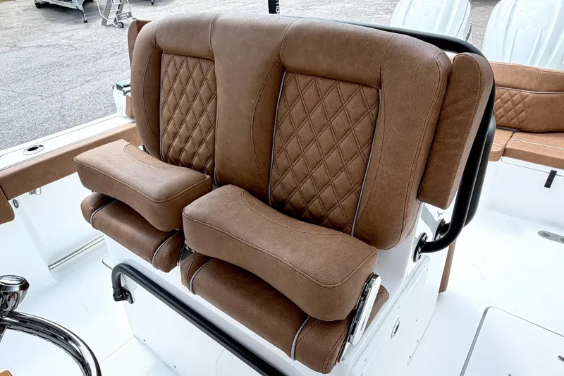 Slide: The Image of Luxurious brown seating on 2027 Sea Hunt Ultra 275SE boat, featuring diamond stitching. - 15