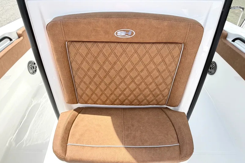 Slide: The Image of Brown cushioned seat on 2027 Sea Hunt Ultra 275SE boat, featuring diamond stitching. - 23