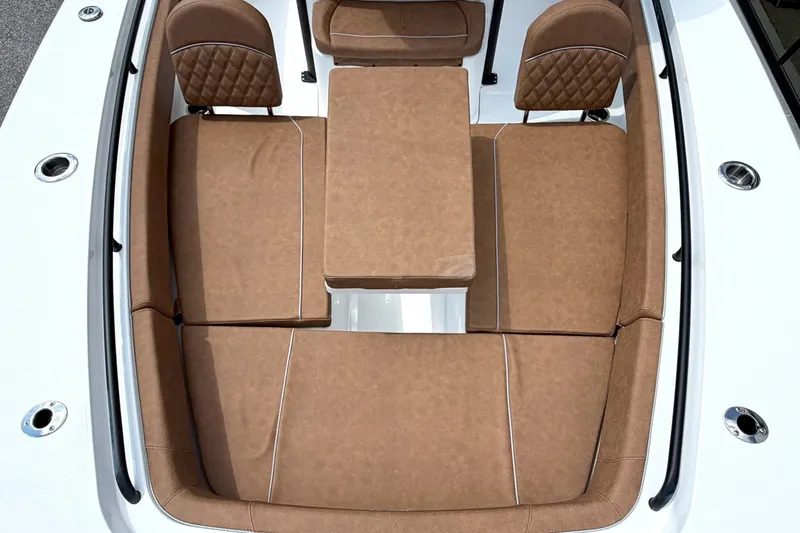 Slide: The Image of Luxurious seating area on 2027 Sea Hunt Ultra 275SE boat, featuring brown cushioned seats. - 24