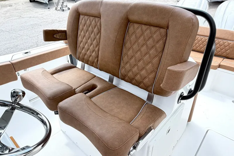 Slide: The Image of Luxurious seating on 2027 Sea Hunt Ultra 275SE boat with diamond-stitched upholstery. - 16