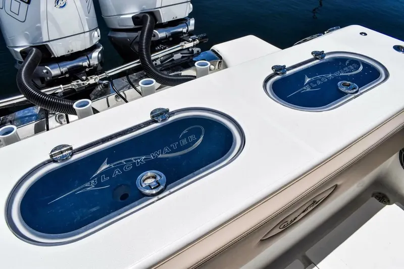 Slide: The Image of Manufacturer Provided Image: 2025 Blackwater 36 Sportfish boat with dual engines and branded livewell covers. - 6
