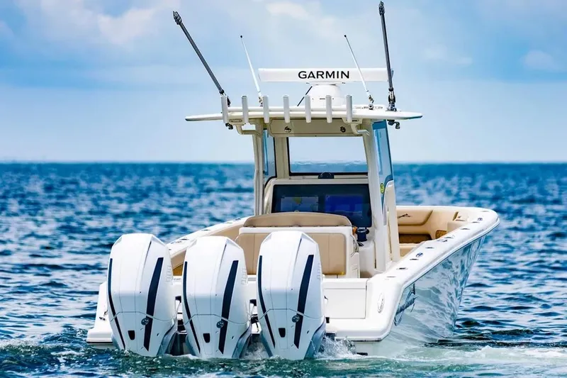 Slide: The Image of Manufacturer Provided Image: 2025 Blackwater 36 Sportfish boat with triple engines cruising on open water. - 1