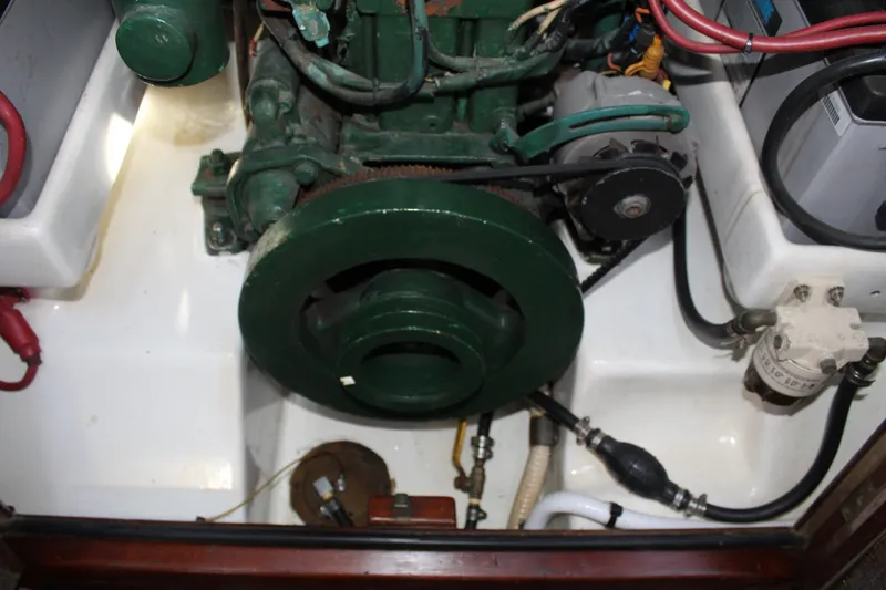 Slide: The Image of Engine compartment of a 1981 Cape George 36 Cutter sailboat, showcasing mechanical components. - 47