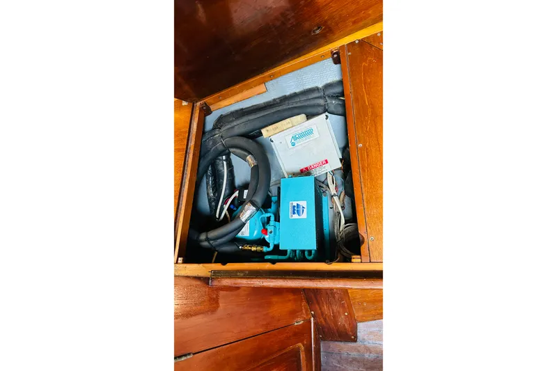 Slide: The Image of Electrical components inside a 1981 Cape George 36 Cutter sailboat. - 48