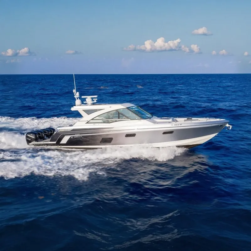 Slide: The Image of The 2018 Formula 430 Super Sport Crossover speeds across the blue sea, featuring four outboard engines. - 0