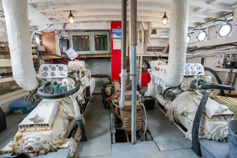 Slide: The Image of Engine room of a 1922 Blanchard Shipyard Custom vessel, featuring vintage machinery and control panels. - 72
