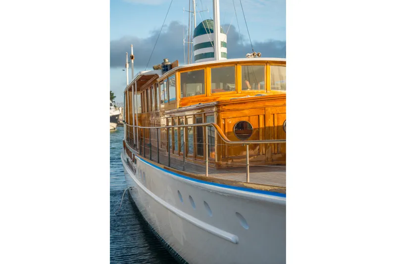 Slide: The Image of 1922 Blanchard Shipyard Custom yacht with wooden cabin, docked in serene waters. - 93