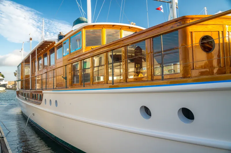 Slide: The Image of Vintage 1922 Blanchard Shipyard custom yacht with polished wood details docked in marina. - 103