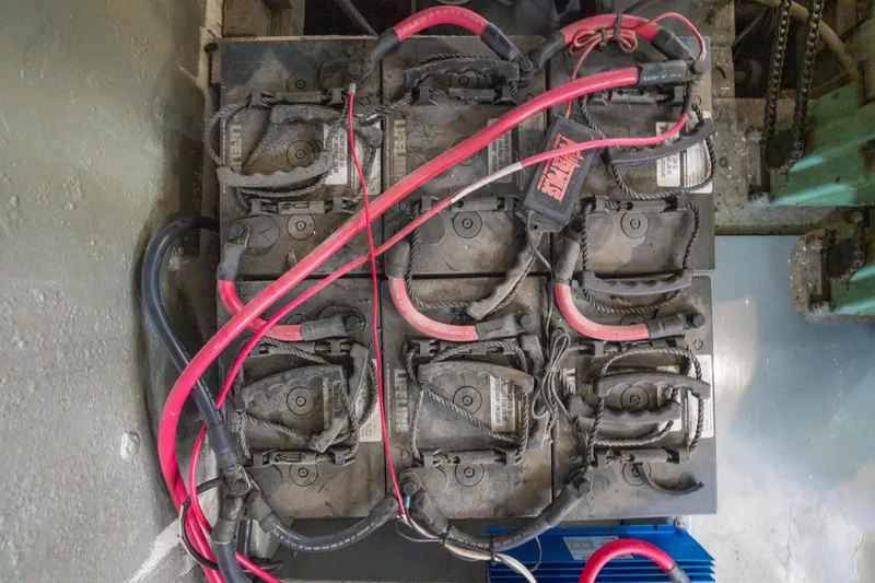 Slide: The Image of Battery setup with red and black cables in a 1922 Blanchard Shipyard Custom model. - 85