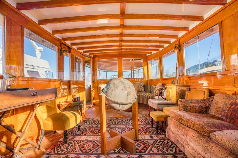 Slide: The Image of Luxurious 1922 Blanchard Shipyard custom yacht interior with vintage decor and wooden finishes. - 5
