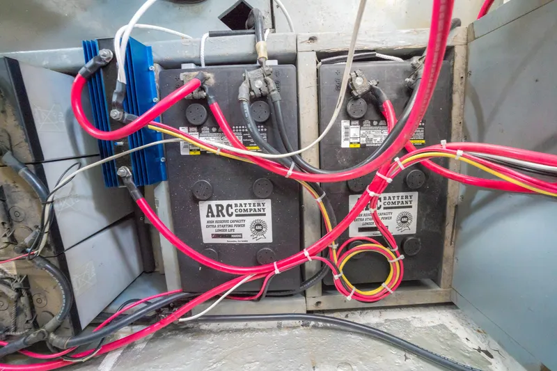 Slide: The Image of Battery compartment with ARC Battery Company units and wiring in a 1922 Blanchard Shipyard Custom model. - 86