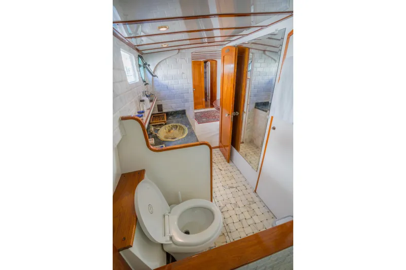Slide: The Image of Bathroom interior of 1922 Blanchard Shipyard custom model with wooden accents and nautical decor. - 56