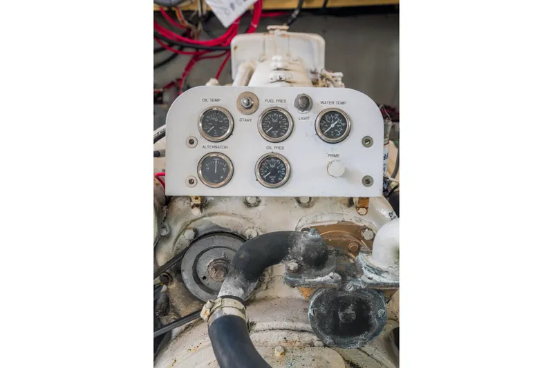 Slide: The Image of Control panel of a 1922 Blanchard Shipyard Custom engine with gauges and dials. - 84