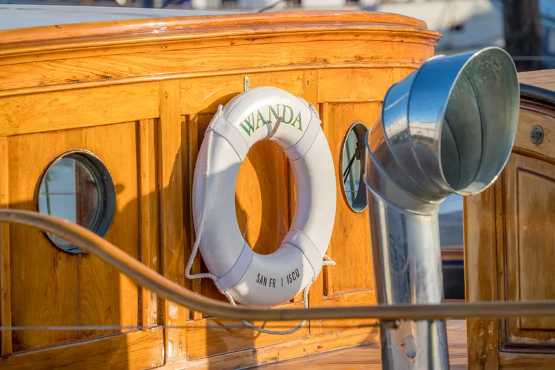 Slide: The Image of Vintage 1922 Blanchard Shipyard boat with lifebuoy and wooden details. - 98