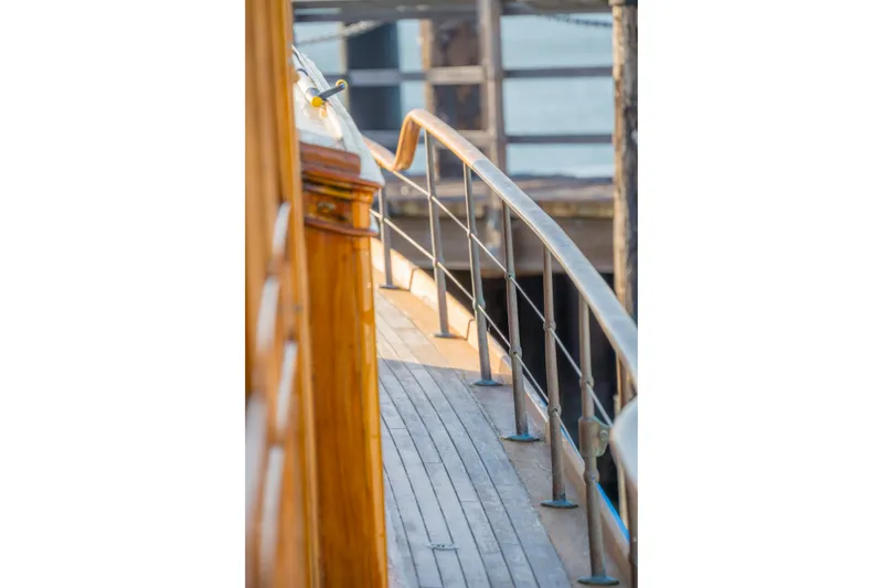 Slide: The Image of Wooden deck and railing of a 1922 Blanchard Shipyard custom boat. - 23