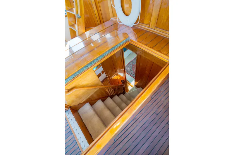 Slide: The Image of Staircase on 1922 Blanchard Shipyard Custom boat with polished wood interior. - 36