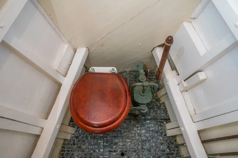 Slide: The Image of 1922 Blanchard Shipyard custom boat toilet with wooden seat and vintage plumbing. - 70