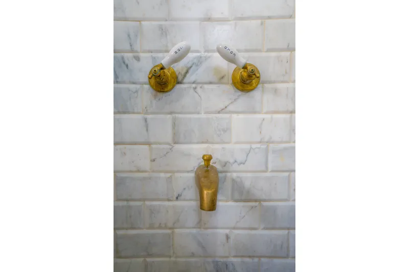 Slide: The Image of Vintage brass faucets on marble wall, Blanchard Shipyard Custom, 1922. - 60