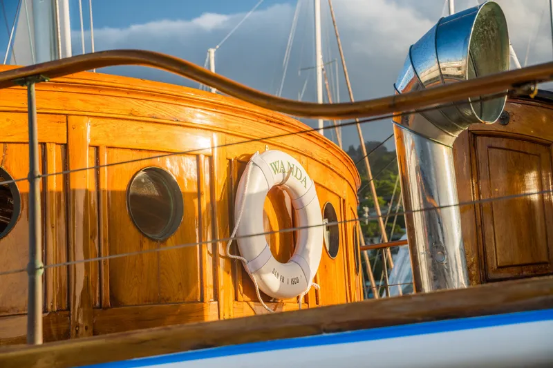 Slide: The Image of Wooden cabin of 1922 Blanchard Shipyard custom boat with lifebuoy and portholes. - 14