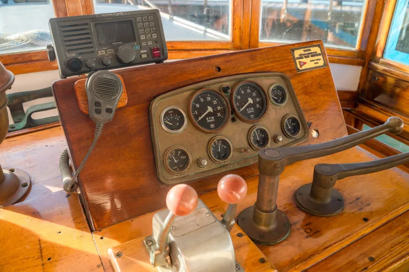 Slide: The Image of 1922 Blanchard Shipyard Custom boat dashboard with vintage controls and radio equipment. - 28