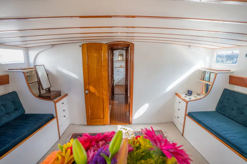 Slide: The Image of Interior of 1922 Blanchard Shipyard custom boat with wooden accents and cozy seating. - 35